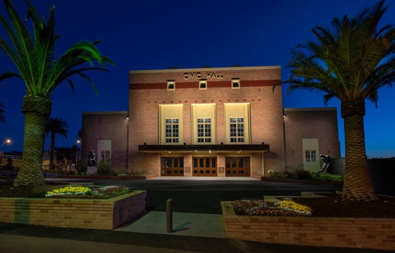 image of a building on a city street in the early evening